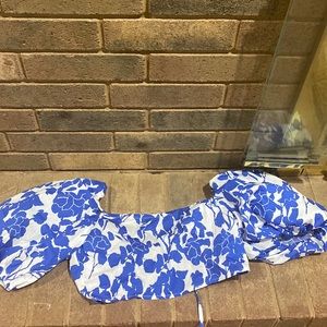 NBW Blue and white floral crop top with puffy sleeves.  Ties in back. Medium.